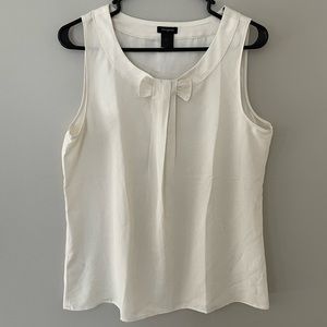 Ann Taylor sleeveless medium blouse with an abstract bow on the front